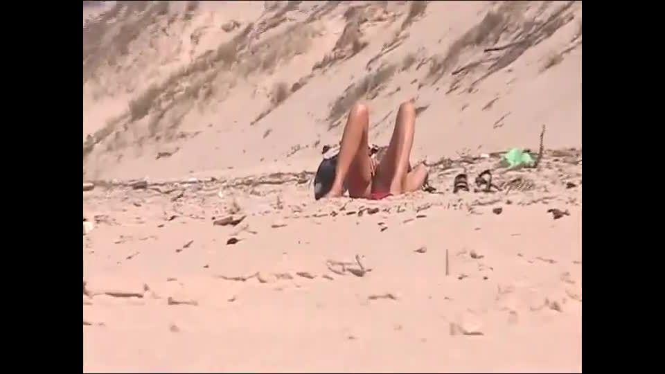 Horny girl spied by a voyeur on a beach