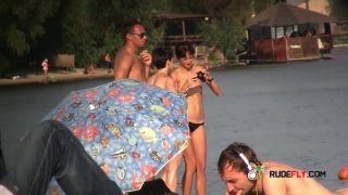 Naturist girls have fun with each other at the strand!  2