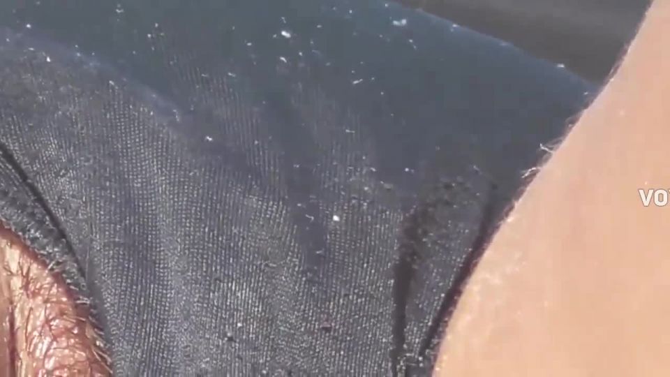 Hairy pussy slip out of thong during suntanning Voyeur!