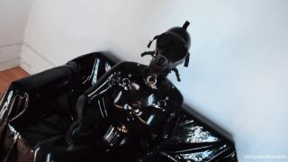 Sniffing dildo in black latex(porn)