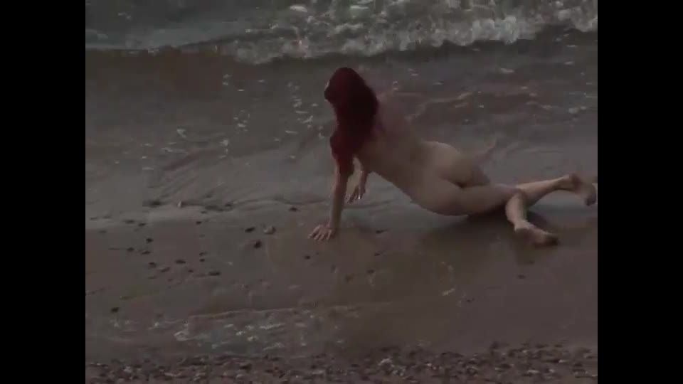 Quirky redhead fucked on a  beach