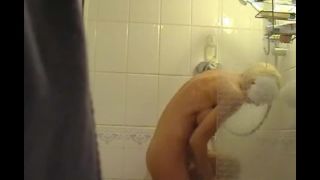 Busty blonde girl fingering pussy in the shower. hidden cam