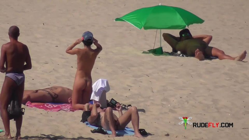 Her sexy body gets a tan after she strips naked  8