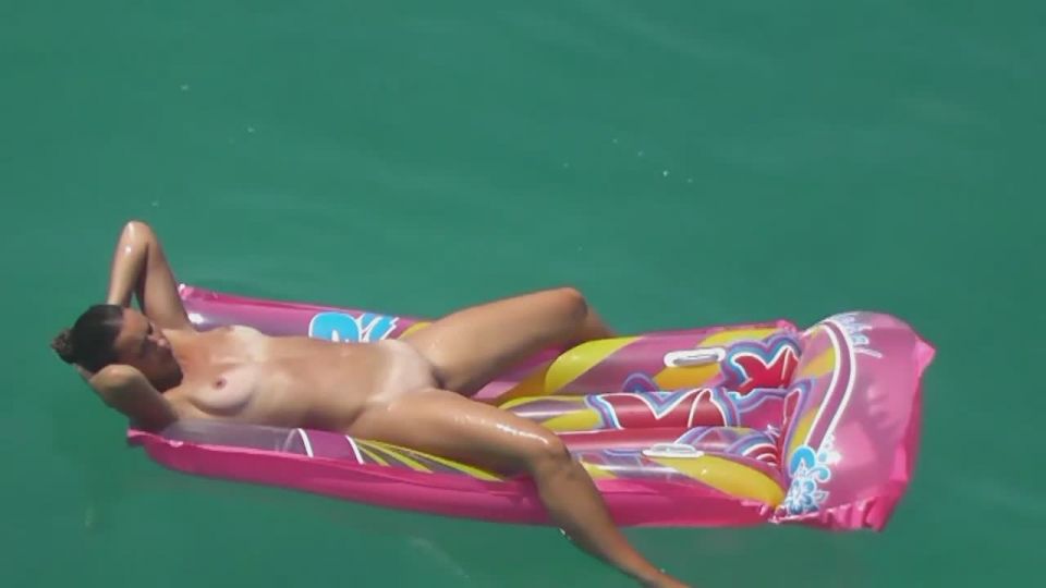 Spread nudist girl floating on water | play | public 